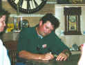 Tracy Byrd signing autographs at his booth