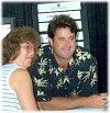 Vince Gill visits with a fan at a Fan Fair Autograph booth