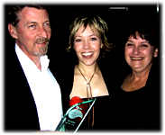 Ron and Rosie are congratulated by Felicity on winning the CMAA Achievers Award for Retailer of the Year